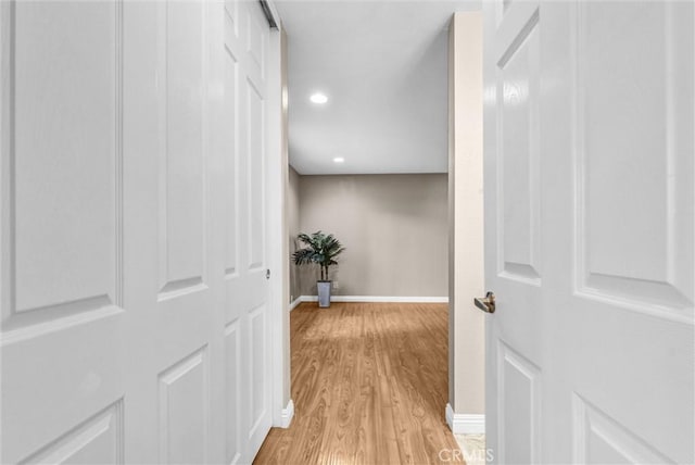 corridor featuring light hardwood / wood-style flooring