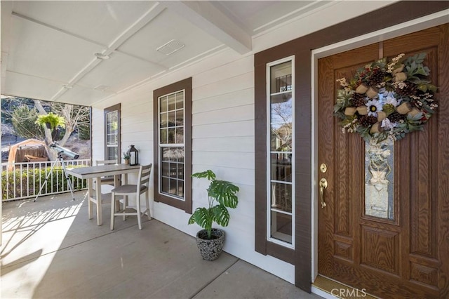 entrance to property with covered porch