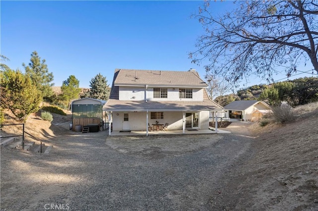 back of house featuring a patio