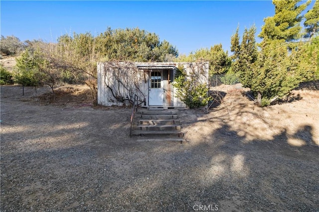 view of front of home with a storage unit