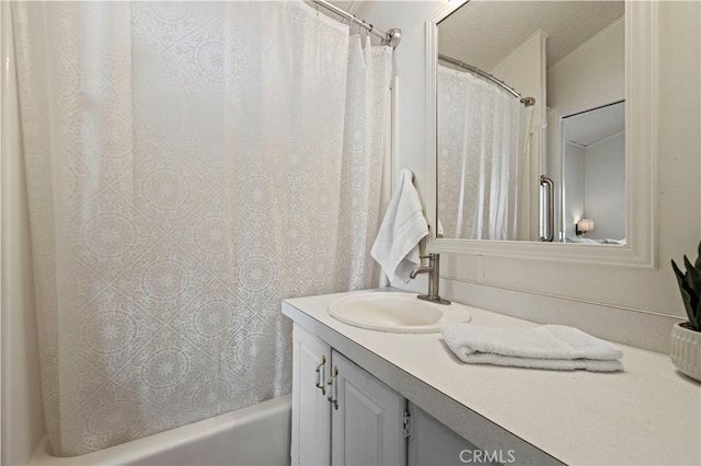 bathroom featuring vanity and shower / tub combo with curtain