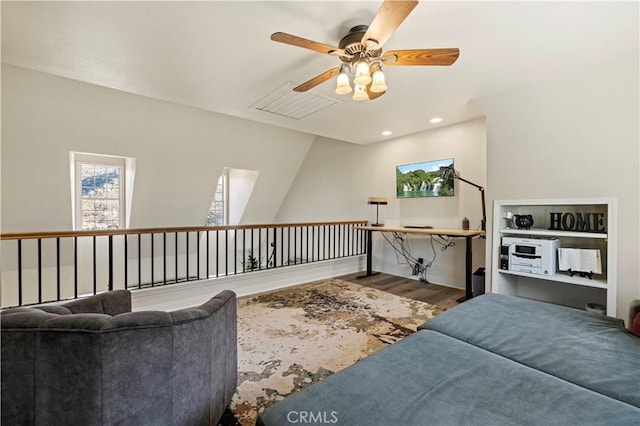 living room with ceiling fan and wood-type flooring