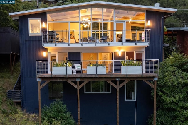 back of house with a balcony