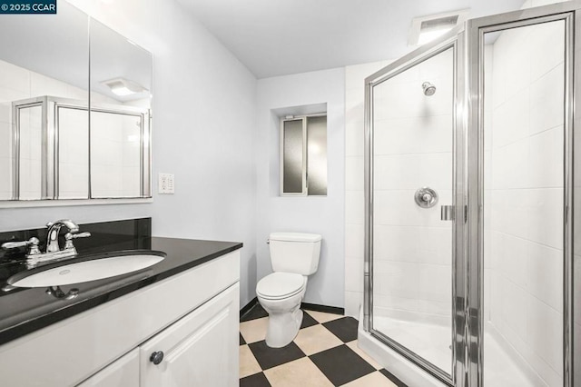 bathroom featuring walk in shower, vanity, and toilet