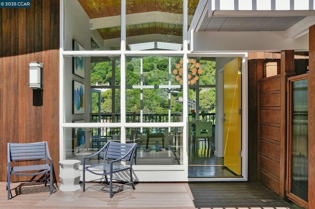 doorway to outside with hardwood / wood-style floors and plenty of natural light