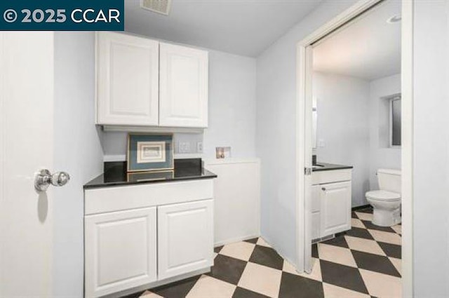 interior space featuring white cabinets