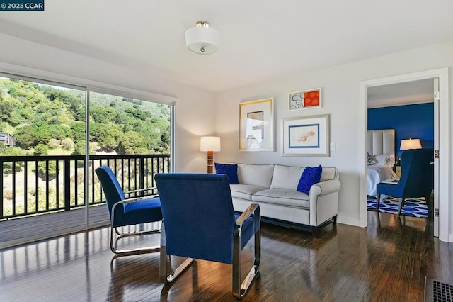 living room with dark hardwood / wood-style floors