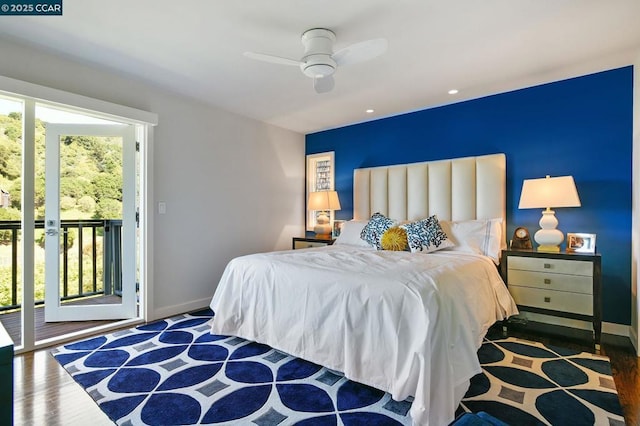 bedroom featuring dark hardwood / wood-style floors, ceiling fan, and access to exterior