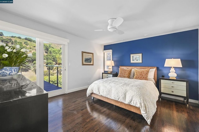 bedroom featuring ceiling fan, dark hardwood / wood-style floors, and access to outside