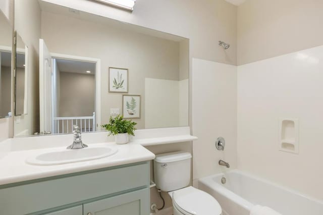 full bathroom featuring  shower combination, toilet, and vanity