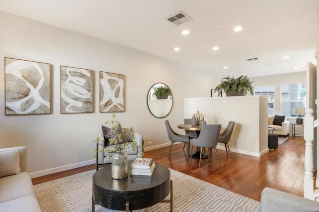 living room with dark hardwood / wood-style flooring