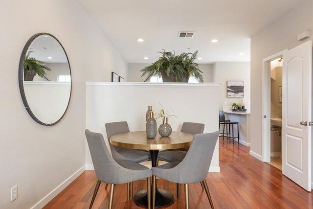 dining room with dark wood-type flooring