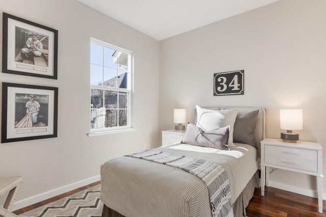 bedroom with dark wood-type flooring