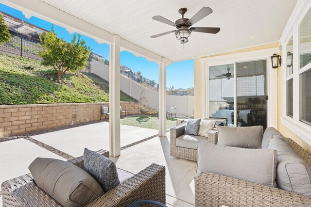 sunroom / solarium with ceiling fan