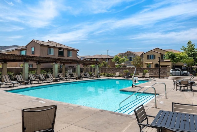 view of swimming pool featuring a pergola and a patio area