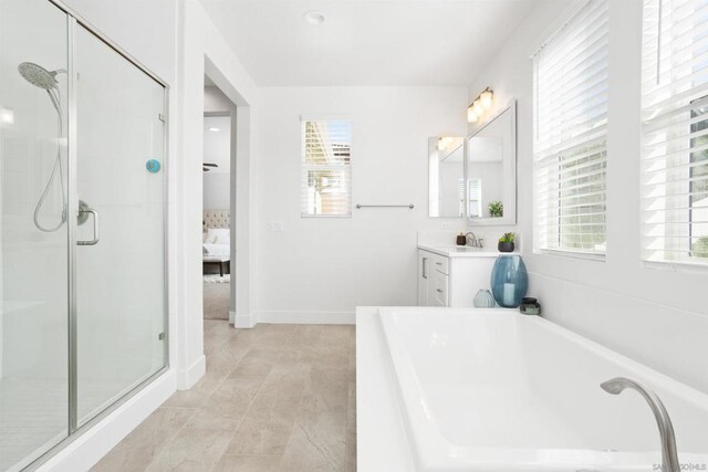 bathroom featuring independent shower and bath and vanity