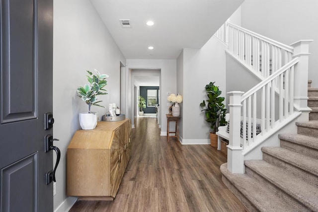 entrance foyer featuring dark hardwood / wood-style floors