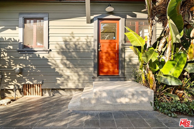 entrance to property with a patio area