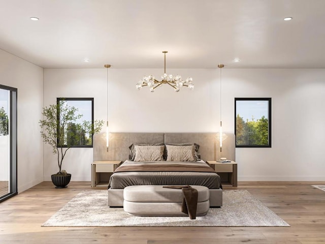 bedroom featuring a chandelier and light hardwood / wood-style floors