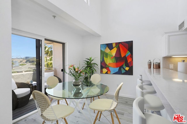 dining space featuring light hardwood / wood-style floors