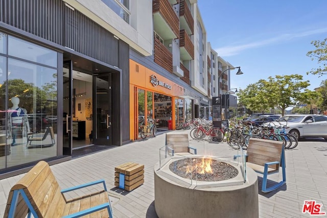 view of patio / terrace with an outdoor fire pit