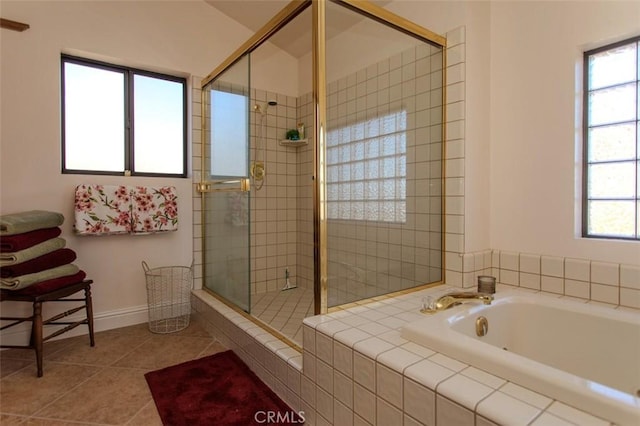 bathroom featuring tile patterned flooring and shower with separate bathtub