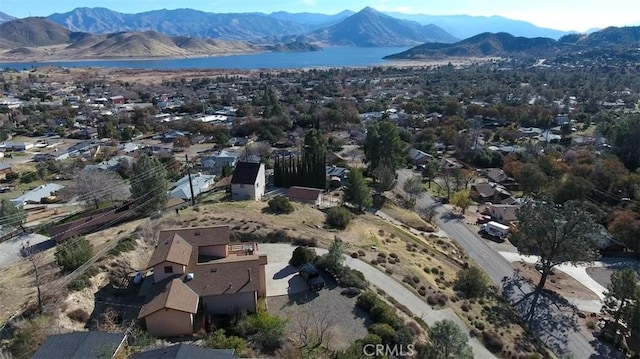 aerial view featuring a water and mountain view