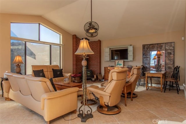 sitting room featuring light tile patterned floors and lofted ceiling