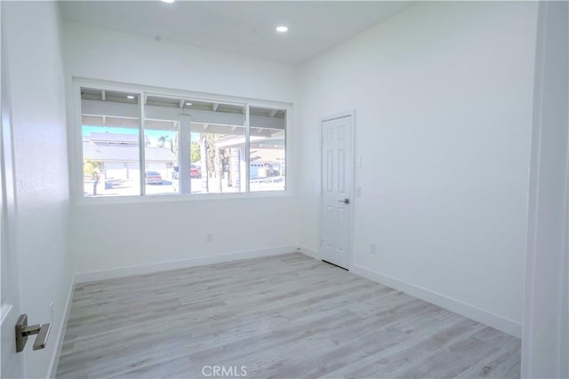 spare room with light hardwood / wood-style floors