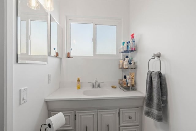 bathroom with vanity and a wealth of natural light