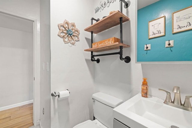 bathroom with toilet and sink