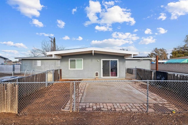 rear view of house with a patio area