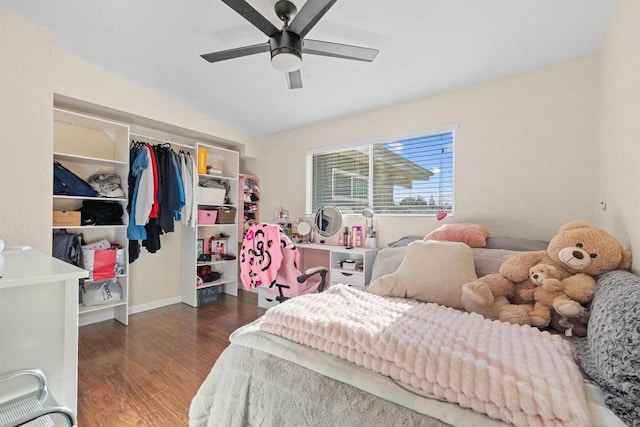 bedroom featuring dark wood-type flooring, ceiling fan, and vaulted ceiling