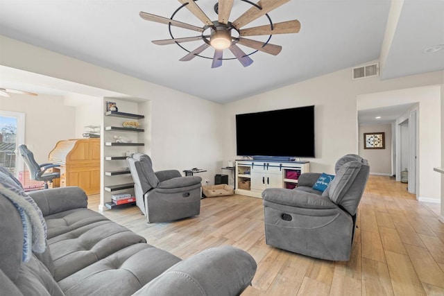 living room with ceiling fan, lofted ceiling, light hardwood / wood-style floors, and built in features