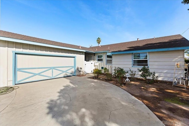 single story home featuring a garage