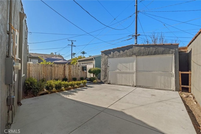 exterior space with an outbuilding and a garage