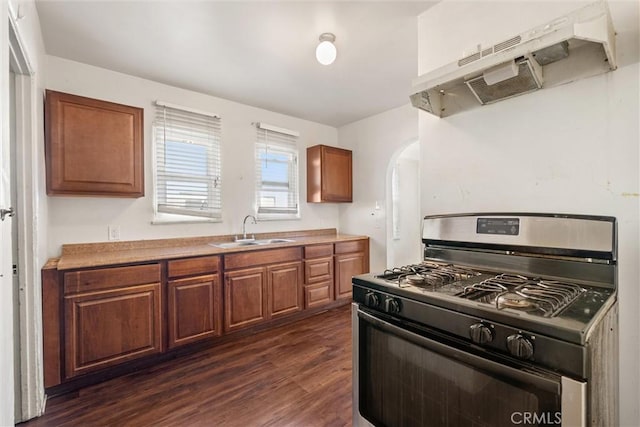 kitchen featuring dark hardwood / wood-style flooring, sink, and stainless steel gas range