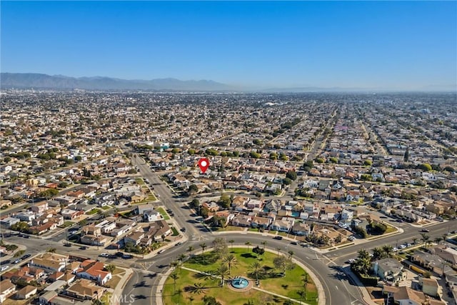 birds eye view of property featuring a mountain view