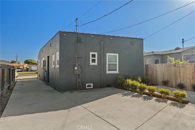 rear view of property featuring a patio