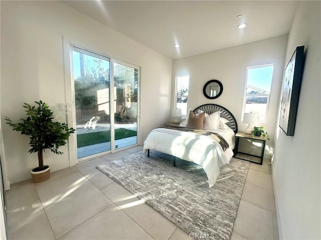 tiled bedroom featuring access to outside