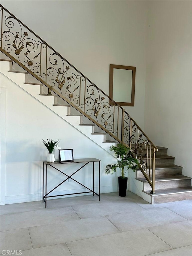 stairs featuring concrete floors