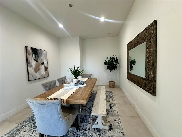 dining area featuring light tile patterned flooring