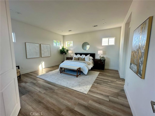 bedroom with hardwood / wood-style flooring