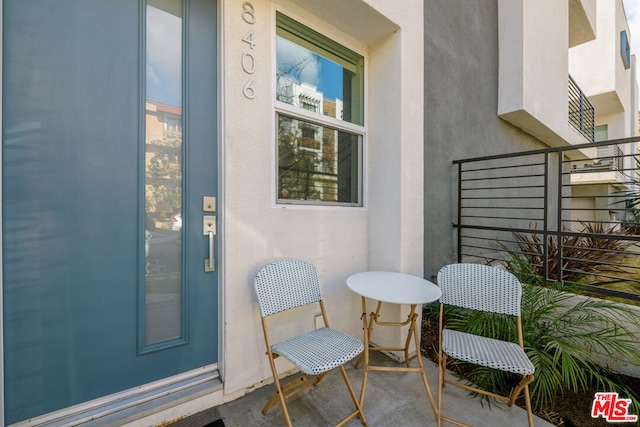 property entrance with a balcony