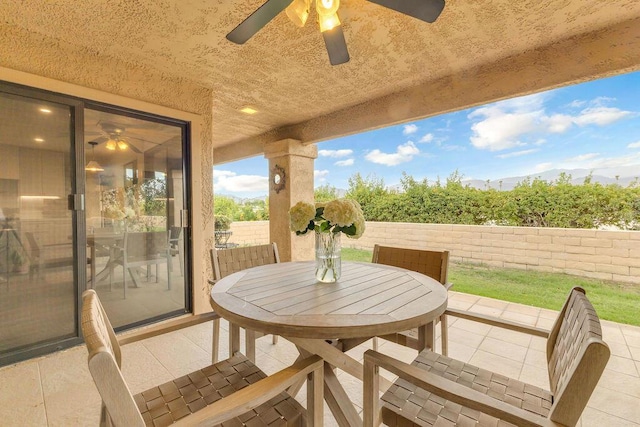 view of patio / terrace featuring ceiling fan