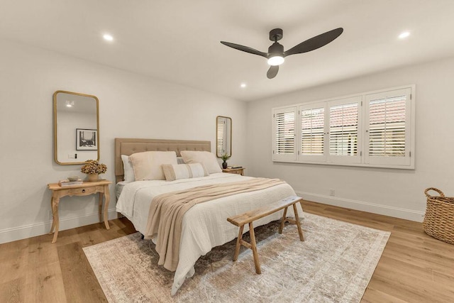 bedroom featuring ceiling fan and light hardwood / wood-style flooring