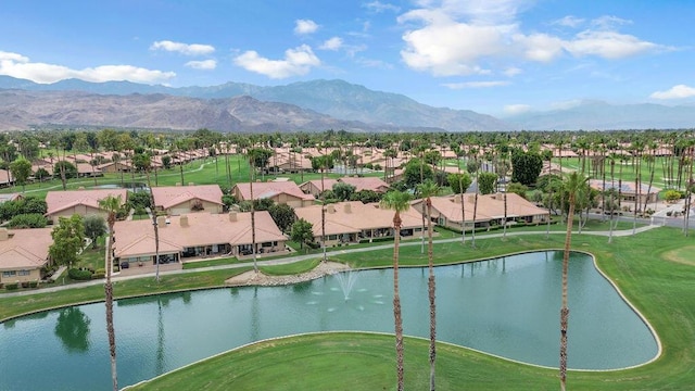 exterior space with a water and mountain view