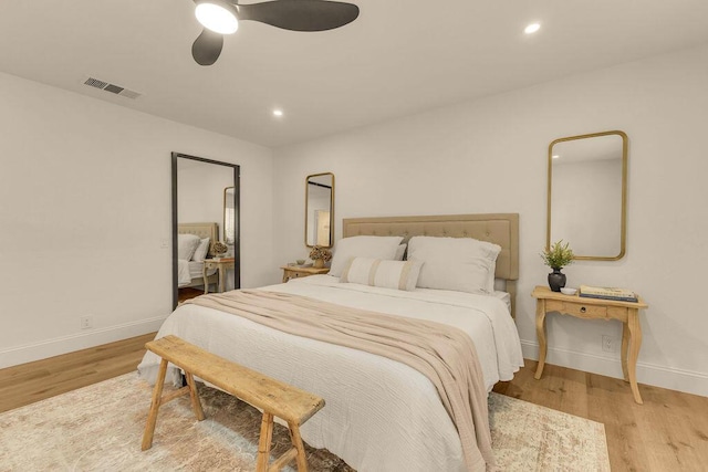 bedroom featuring ceiling fan and light hardwood / wood-style floors