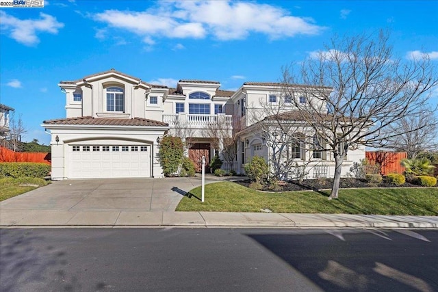 view of front facade with a front yard, a garage, and a balcony