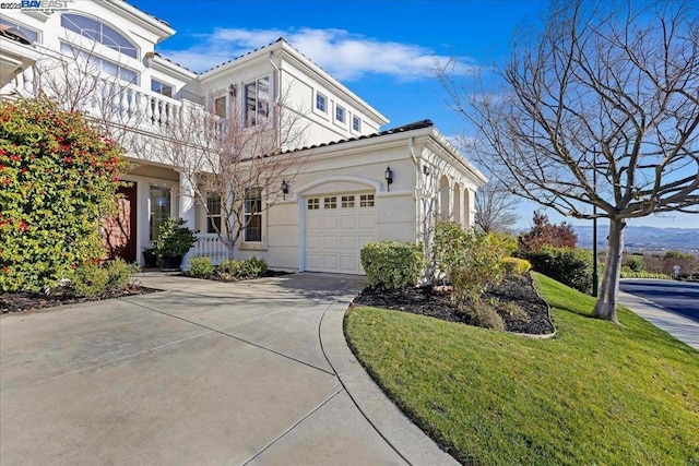 view of property exterior featuring a yard and a garage